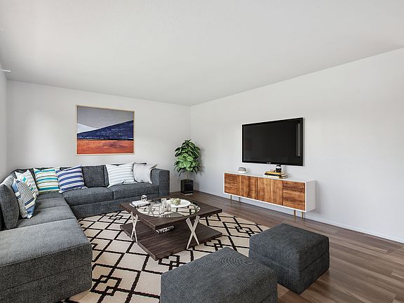 Living room including ideas on how to arrange furniture (decor and furnishings are not included in the rent)