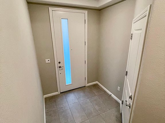 Interior shot of front door and garage door