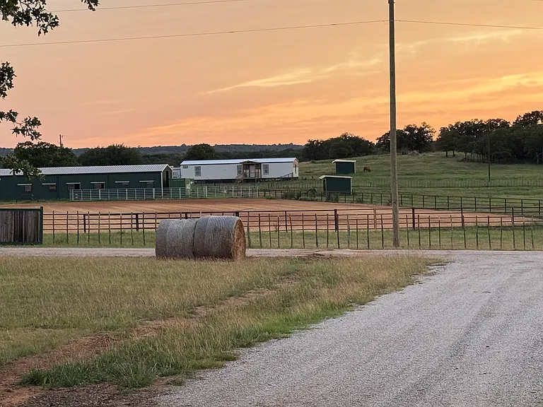 View of home which is adjacent to a barn.