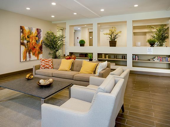Relax in our inviting community clubhouse, featuring a cozy atmosphere, a selection of books, and access to television for your entertainment.