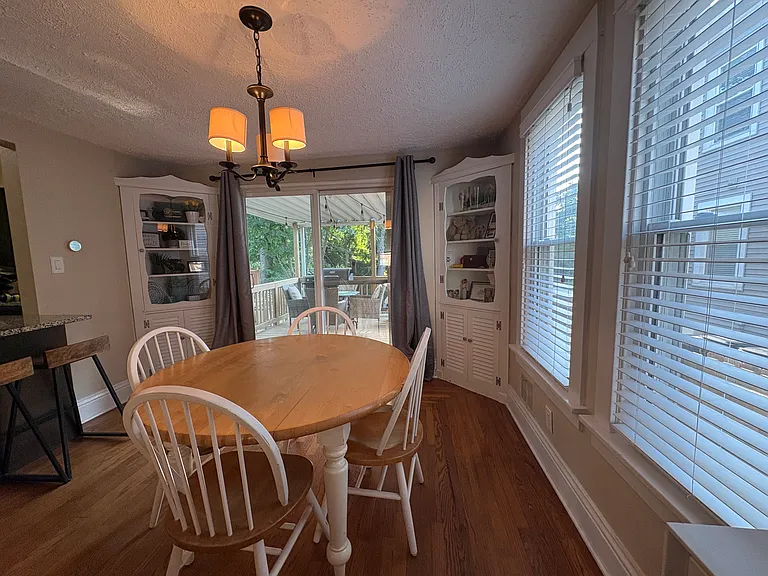 Dining room with two built in display and storage cabinets