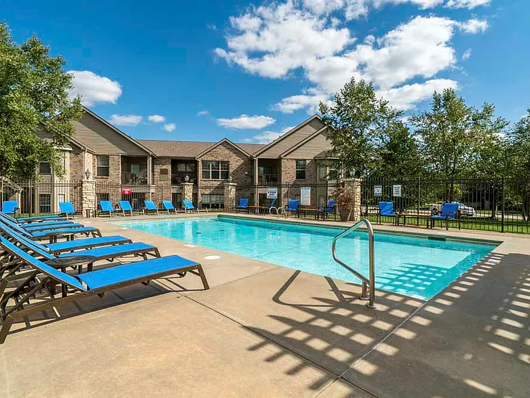 On a hot day, you'll love taking a dip in the pool and relaxing in the lounge chairs.