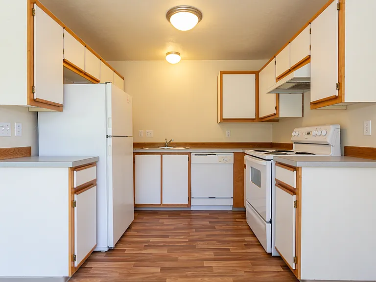 * Photo is of a 2 bedroom kitchen. Cabinetry in our 670 Sq. Ft 1 bedroom home will be similar.