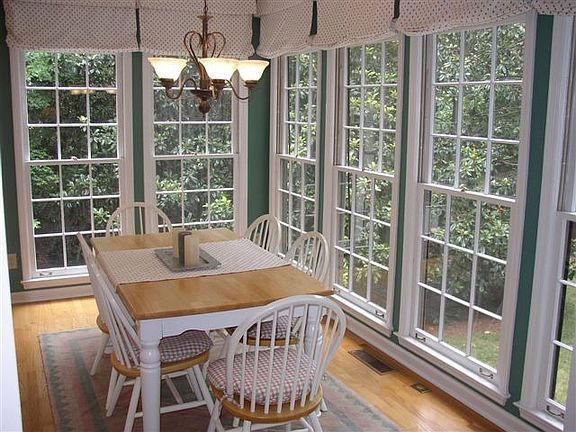Bright Breakfast Area Overlooks Backyard Paradise