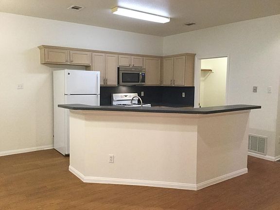 Large open kitchen area with bar stool seating