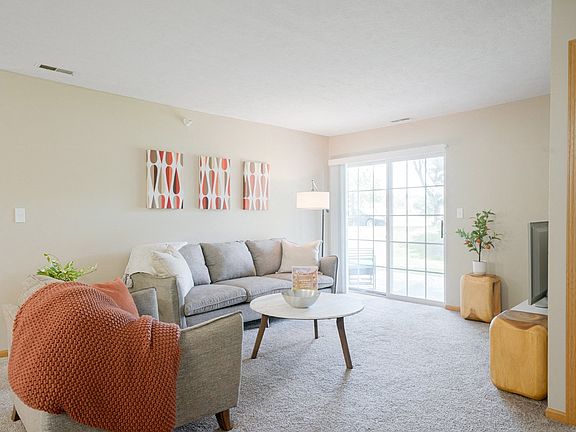 Our bright and cozy living rooms feature large sliding doors, inviting natural light and seamless indoor-outdoor living.