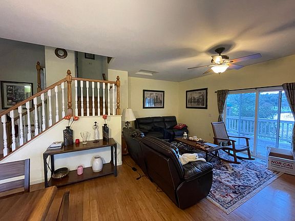 Living room with fireplace and attached Patio