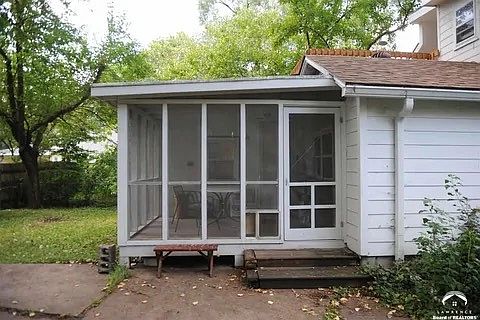 Screened-in porch in backyard