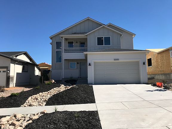 Farmhouse Exterior Photo representing home to be built and may demonstrate optional features