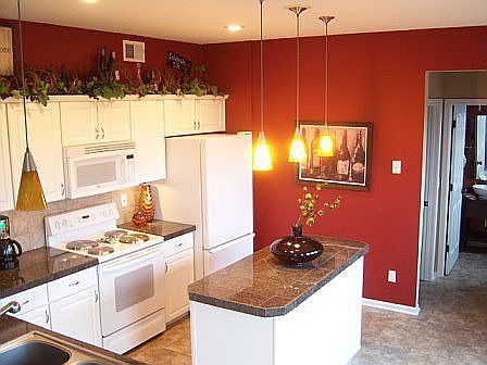 Kitchen has granite, tile, and great lighting