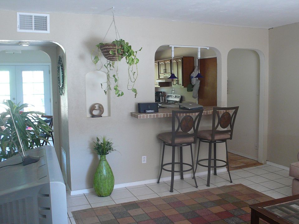 living room facing kitchen and dining