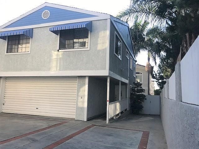 Front of house at the bottom of driveway- Safe and Secure off street with extra parking place on side for three cars total including 2 car garage. Brand new awnings!