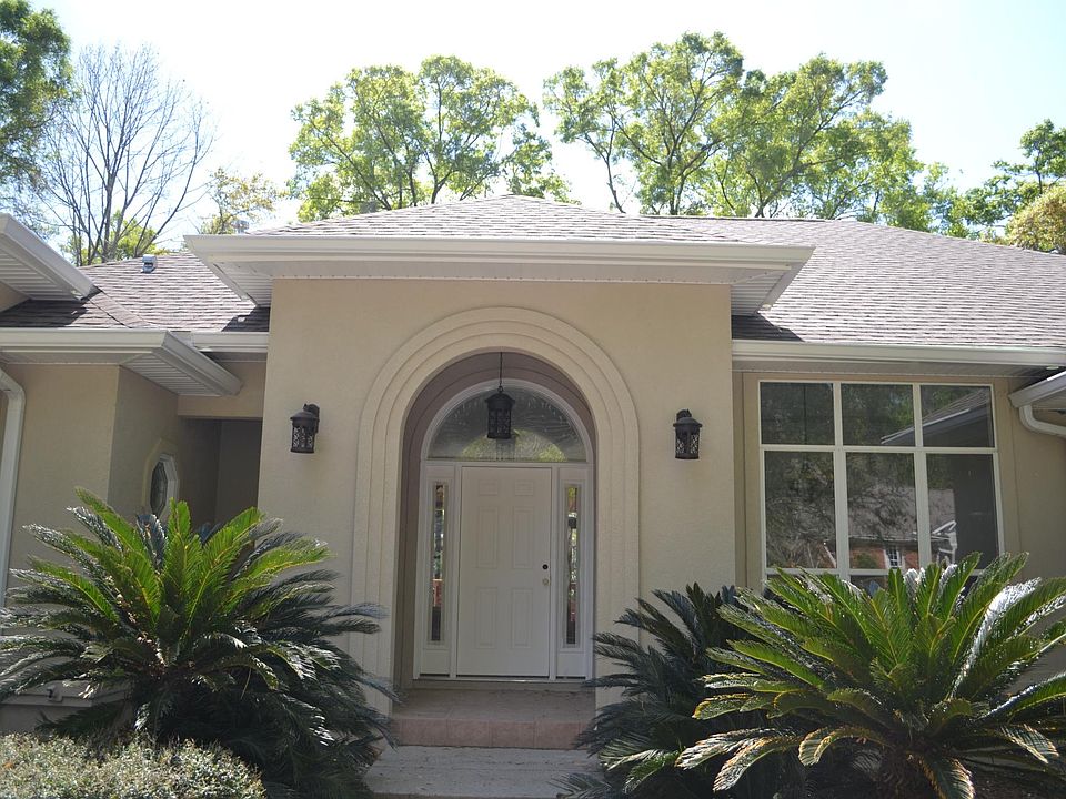 Entrance portico with dining room window on right
