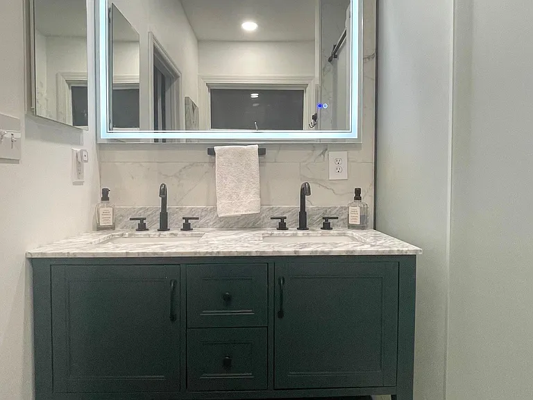 LED light (multiple settings) with anti-defogging mirror. Medicine cabinet for additional storage