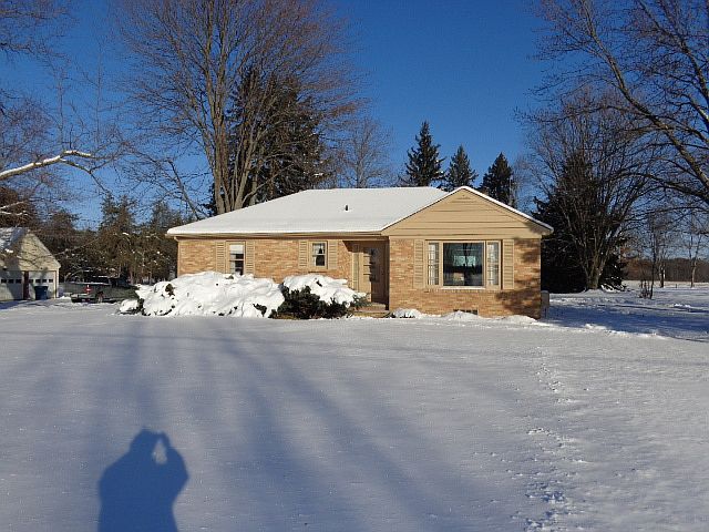 WELCOME HOME!!  This well maintained brick ranch was built in 1957.  Original owners. Full basement and 2 car detached garage. Nestled on a lovely 1 acre lot. Covered patio off garage,  overlooking the beautiful back yard. Plaster walls and hardwood flooring under the carpet.  Fireplace in living room.  Central Air.  City water and the assessment has been paid in full. Lots of storage Freshly painted exterior trim.