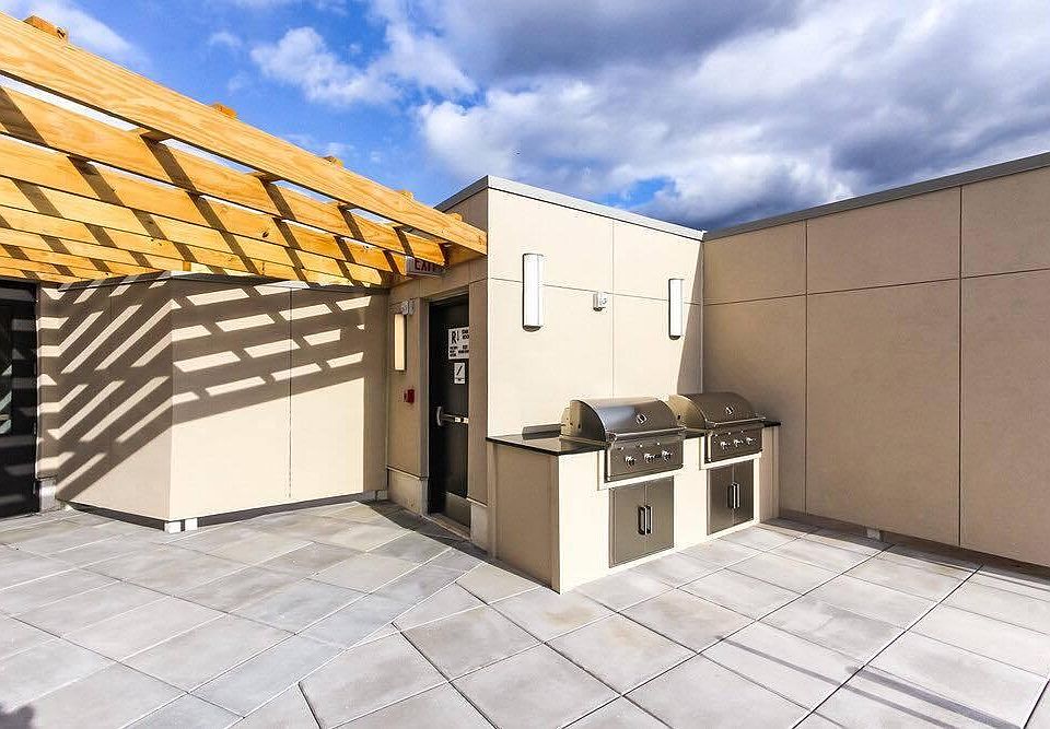 The shared roof deck and grilling station
