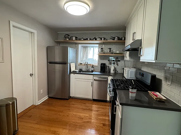 Open kitchen layout with dishwasher.
