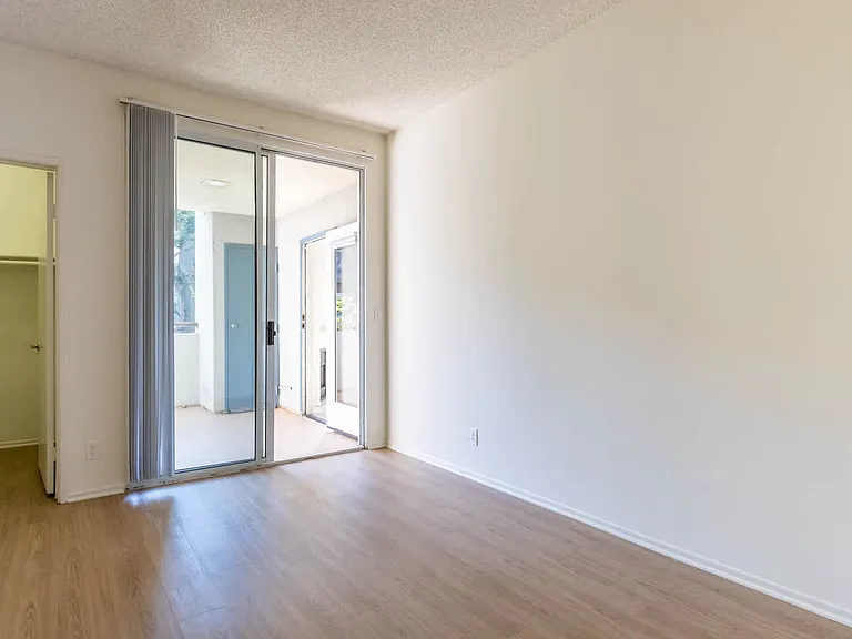 Bedroom with Balcony and Hard Surface Flooring
