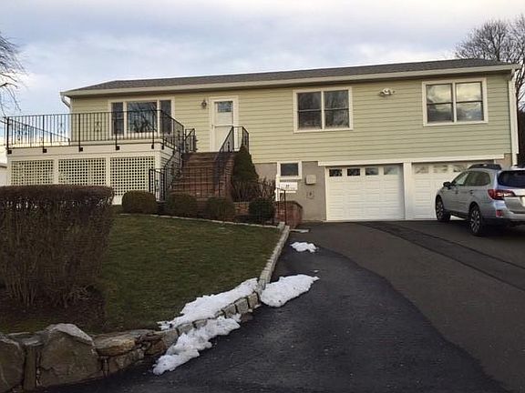 Exterior with Deck and 2-Car Garage