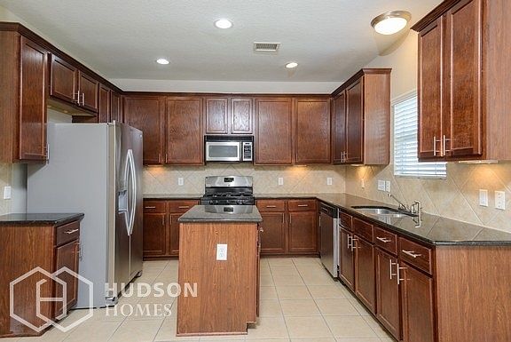 Hudson Homes Management - Kitchen featuring Stainless Steel Appliances