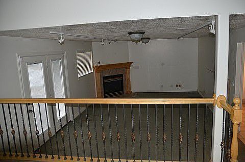 Family room with track lighting and gas fireplace