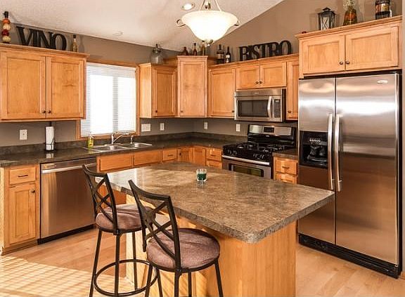 All appliances stay with the home. Stainless steel and the range is also gas. New over the range microwave.