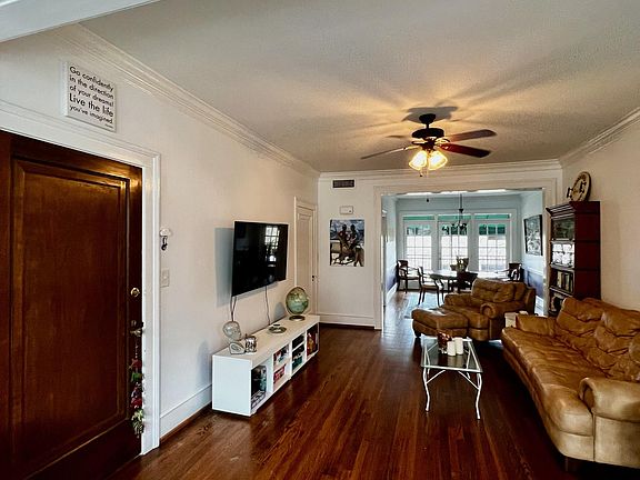 One entrance leads to the interior stairwell and street-side parking, while the french doors take you to the patio and exterior stairs, leading to the parking lot