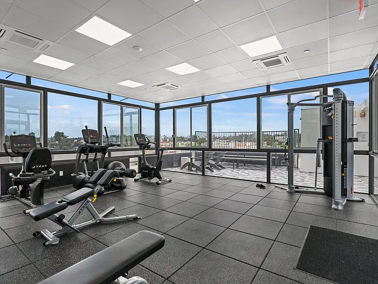 Fitness Center with Treadmill, Stationary Bike, and Elliptical Machines