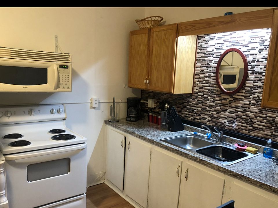 furnished kitchen includes microwave and range/oven