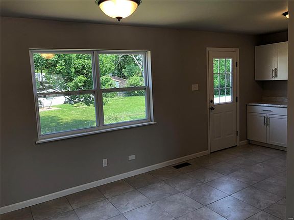 View of the breakfast room and door to backyard.