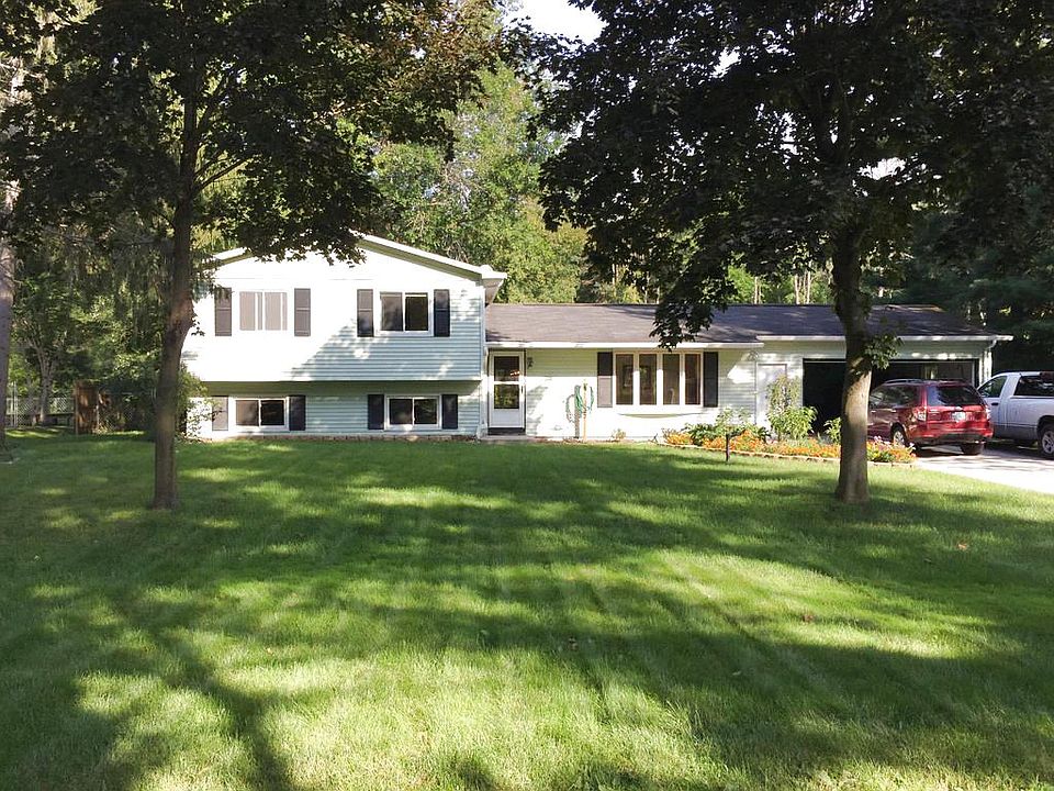 A little bit of country close to town & Midland Schools!  The 2001 addition is a must-see space with skylights and a lovely view of the spacious back yard.  The house also features a  gas fireplace, heated workshop, shed, fenced back yard, city water and natural gas.  Don't miss out on this one!