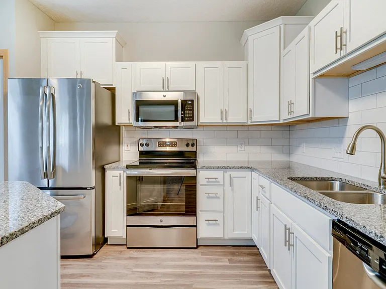 Renovated Tree Haven kitchen with upgraded cabinets, appliances, counters, and more.