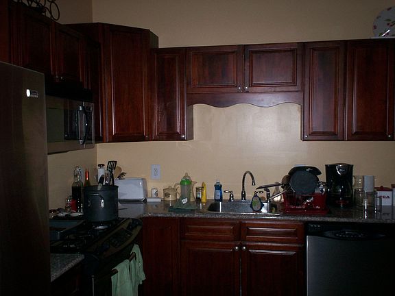 Cherry Cabinets with Stainless Steel Apps.