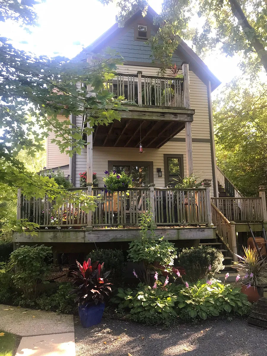 Back facade of building with private decks for each unit and lush back yard. - 1307 Washington St #1