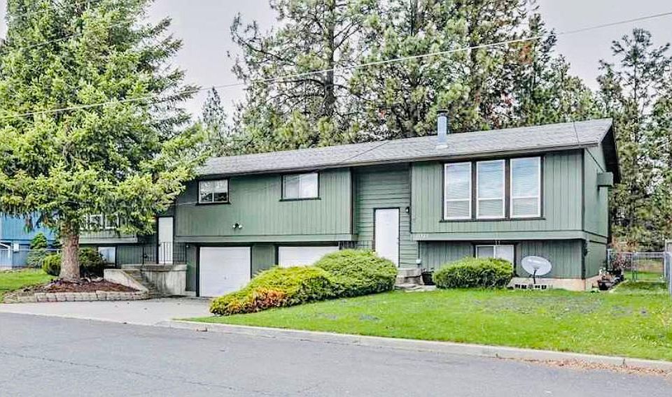 Front view of Duplex, juniper bushes removed with beautiful landscaping completed this weekend...large pine tree in front will be trimmed up...