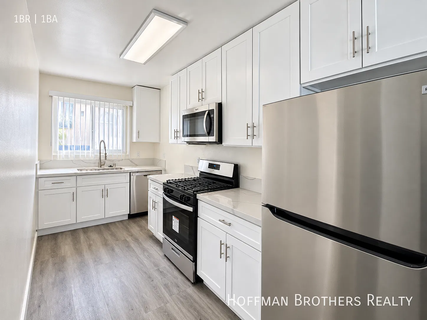 Updated 1 Bedroom With Stone Counters, Stainless Steel Appliances & On-Site Laundry! — Photo 2