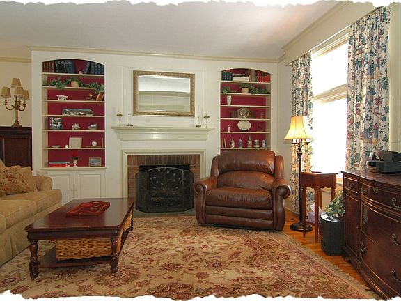 Living Room w/ Fireplace & Book Shelves