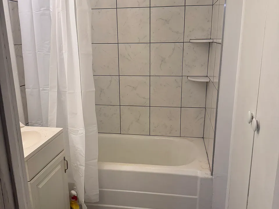 Bathroom with new tile shower and floor.