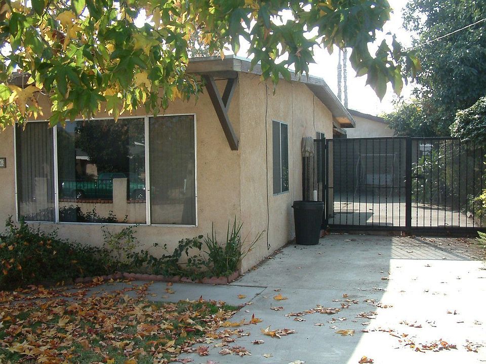 Garage side of house with iron gates