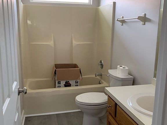 Bathroom #1. Newly painted and caulked, new toilet, new door. All drawers and cabinets newly lined.