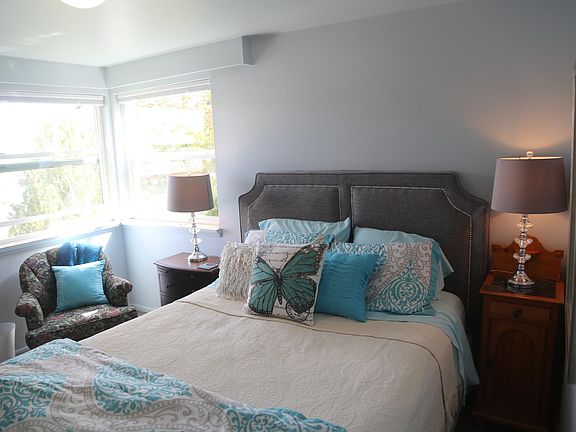 First Bedroom featuring Queen Bed with water views out the window