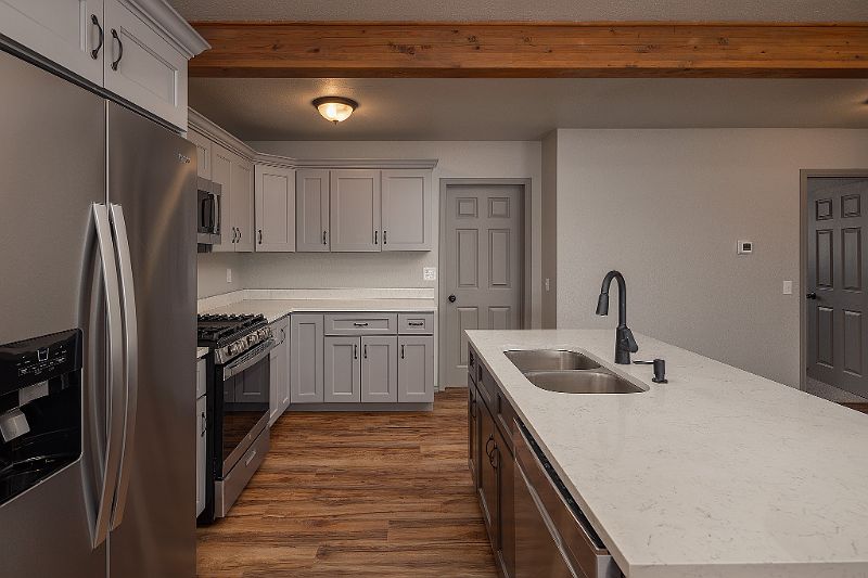 Kitchen w/ Stainless appliances and Quartz Counters