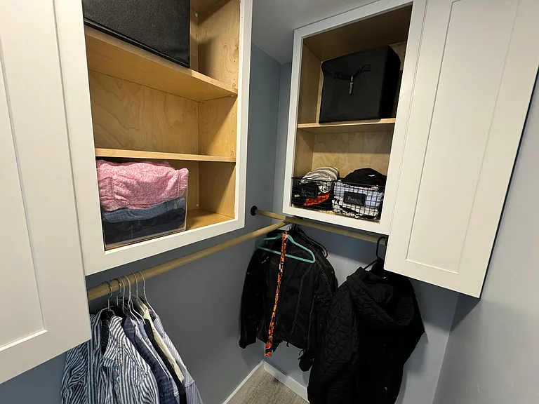 master closet with closed and open shelving, hanging bars.