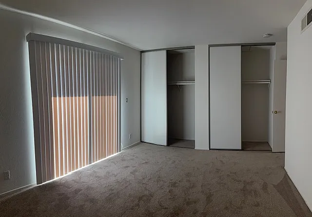 Master Bedroom with sliding door leading to back patio