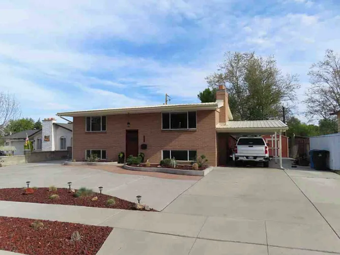 Front of house, carport parking with rental