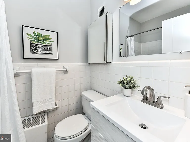 Bathroom with art-deco era floor tiles.