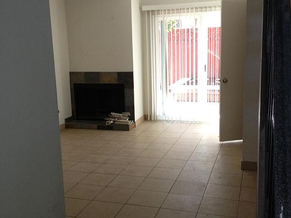 room with gas fireplace, fenced rear yard