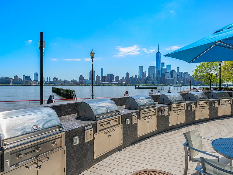 Unwind with poolside grilling and stunning river views at Riverside