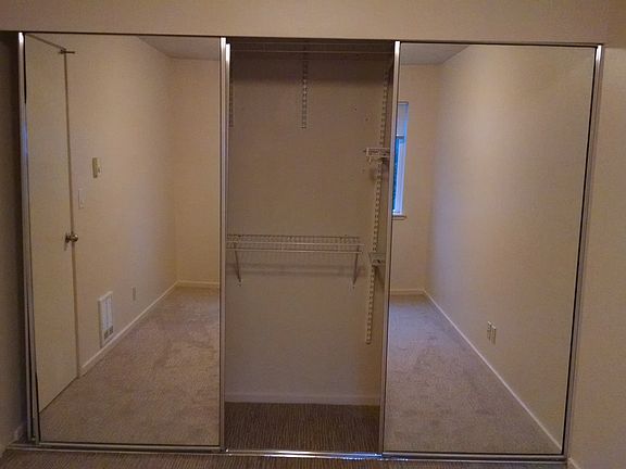 Large, mirrored bedroom closet