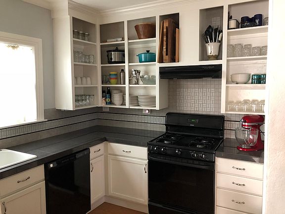 Updated and open kitchen with lots of natural light, and und